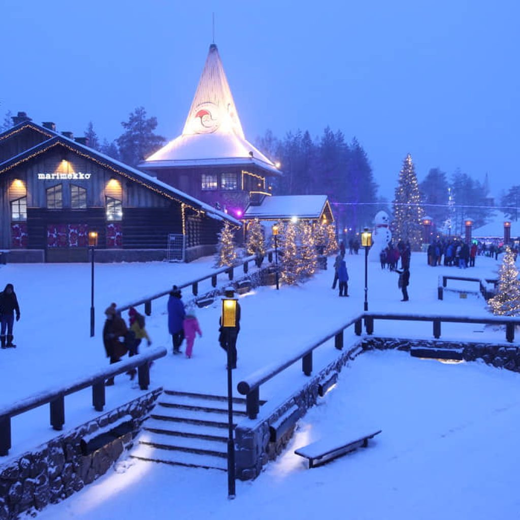 An image of tourists visiting the Santa Claus Village in Finland.