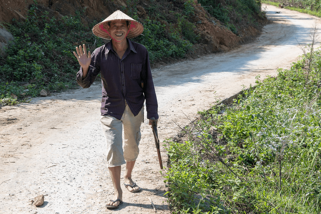 An image of a local trekking a mountain trail at Sapa