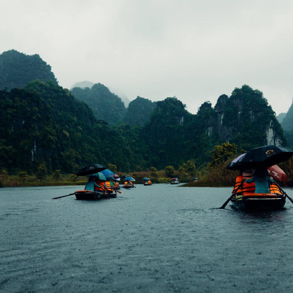 An image of tourists on boats in Ninh Binh, Vietnam