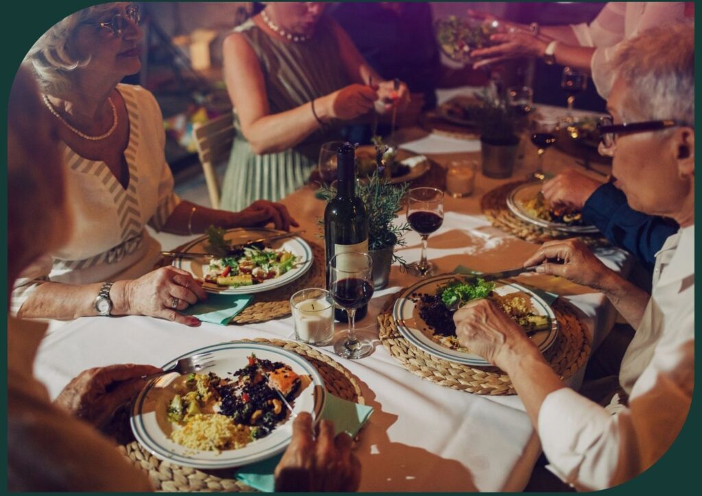 Seniors dining in a themed dinner setting.