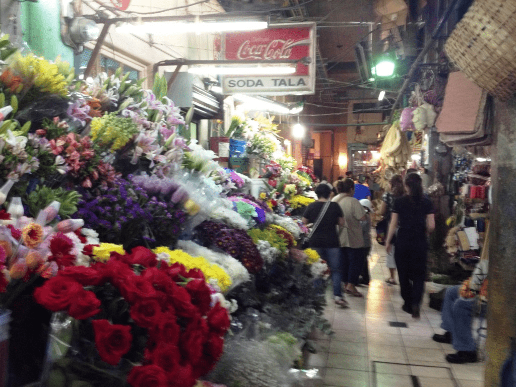 An image of flower vendors inside the San Jose Central Market. 