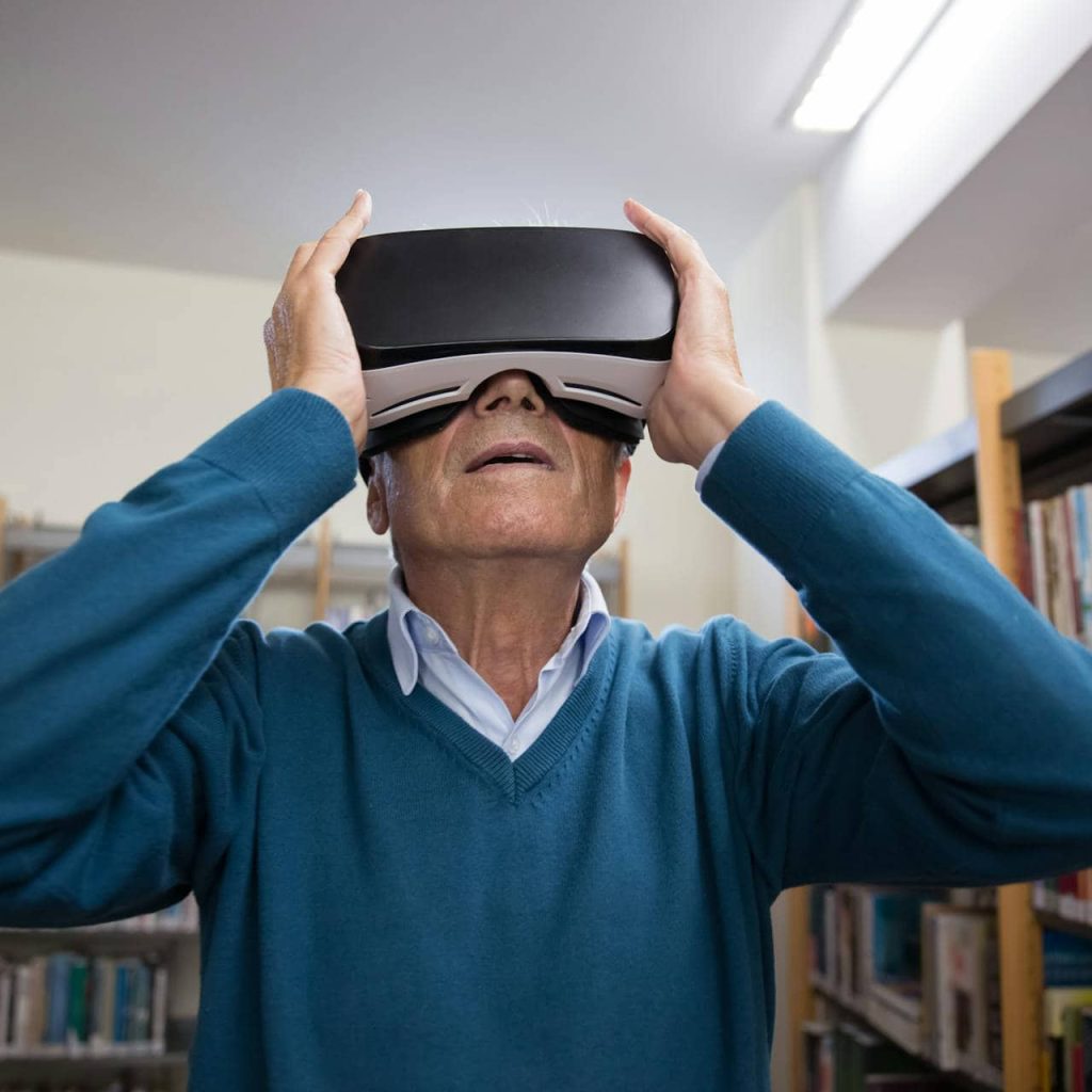 A retiree trying out a senior VR entertainment.