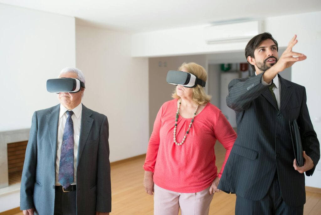 A senior couple using VR to view a home. 