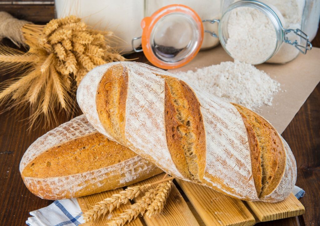 Sourdough bread, traced back to Egypt, is made with wild yeast and lactobacilli for a tangy taste and chewy texture.