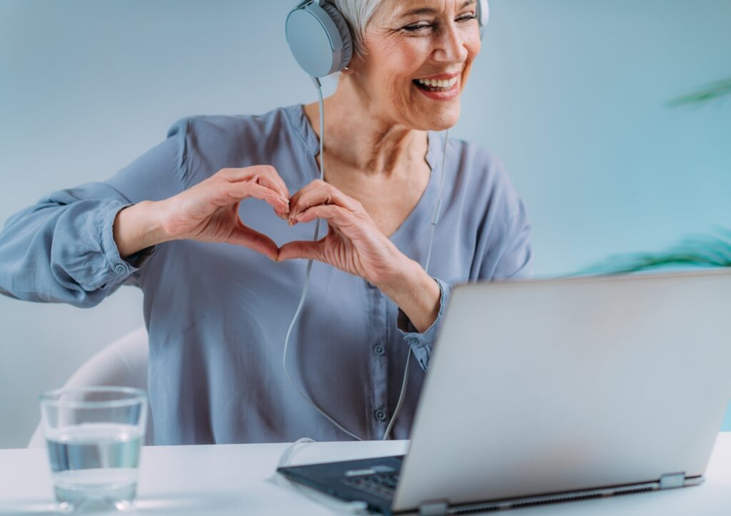 a senior on a video call with loved ones