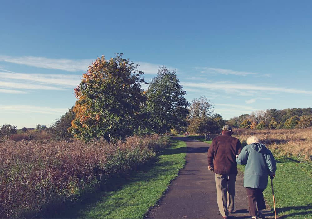 A senior couple walking together