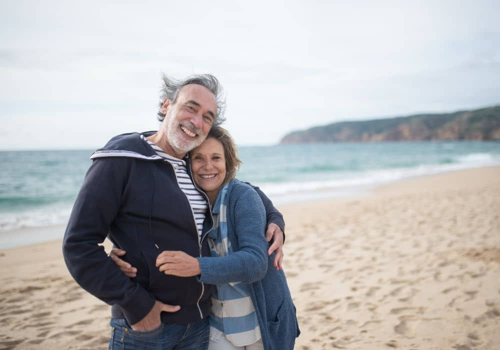 an image of a retired couple on a trip to the beach. 