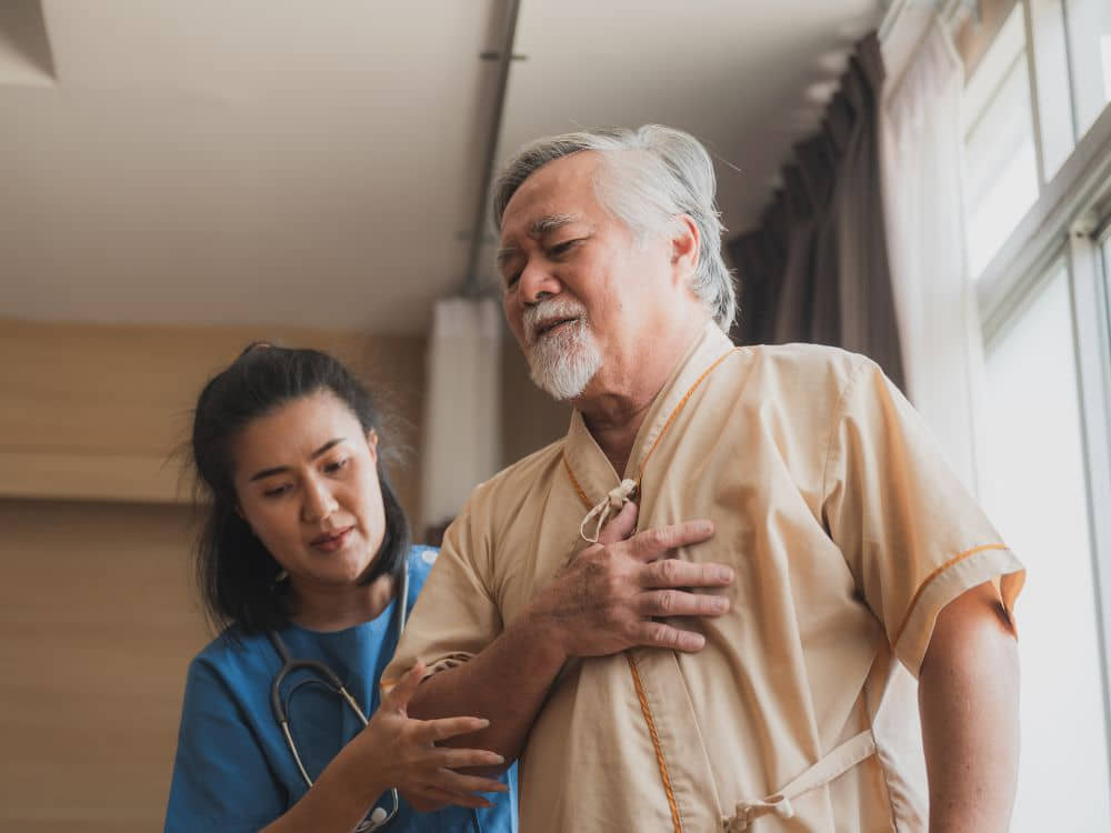 A senior consulting a health professional
