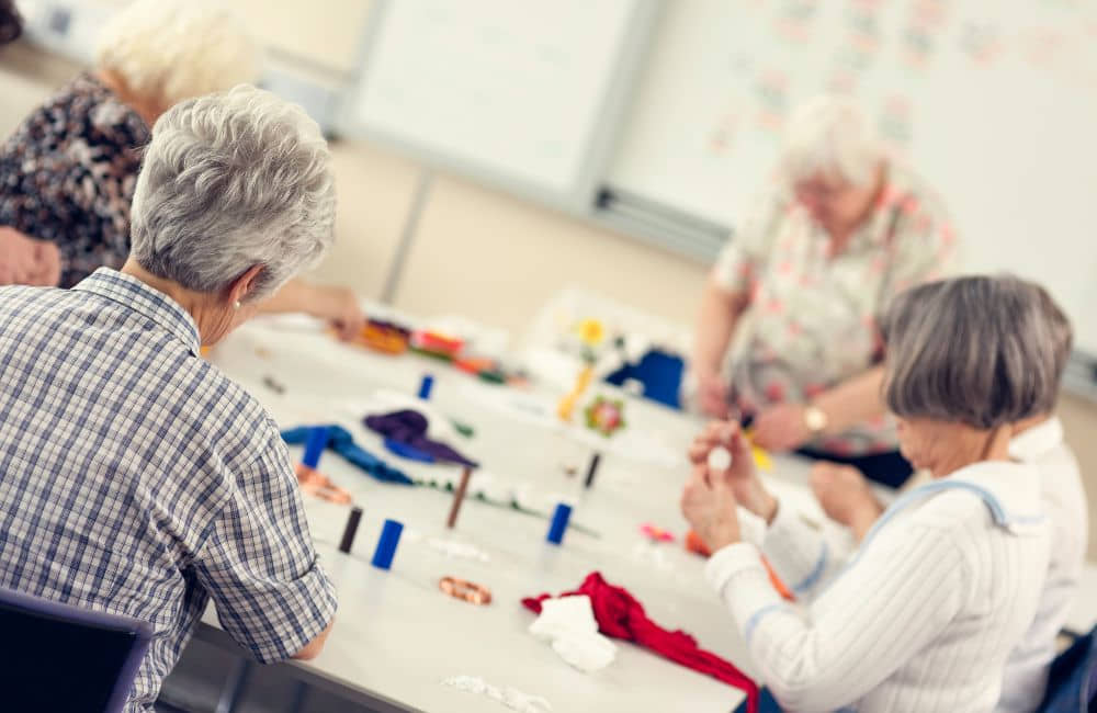 An image of seniors doing craft work. 